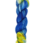 A skein of hand-dyed fingering/sock yarn color white yellow blue 