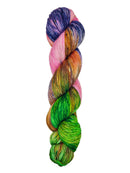 A skein of hand-dyed fingering/sock yarn color pink orange green navy speckles