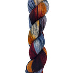 A skein of hand-dyed fingering/sock yarn color red orange blue yellow speckles