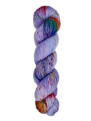 A skein of hand-dyed fingering/sock yarn color purple red green blue red orange speckles