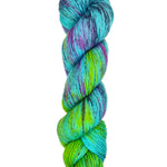 A skein of hand-dyed fingering/sock yarn color blue purple green navy black speckles