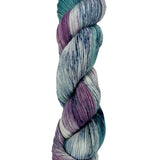 A skein of hand-dyed fingering/sock yarn color teal purple grey navy speckles