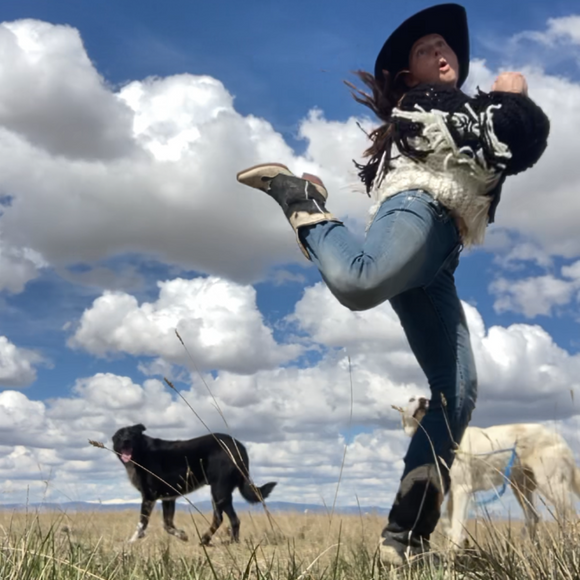 BJ, a brilliant local fiber artist showing off her latest sweater with her dogs.