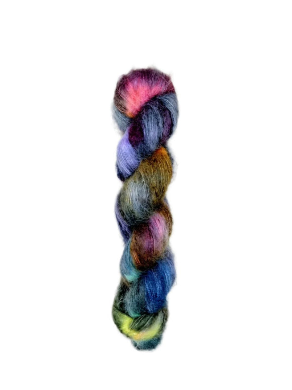 Skein of superkid mohair silk lace weight yarn color black red green yellow