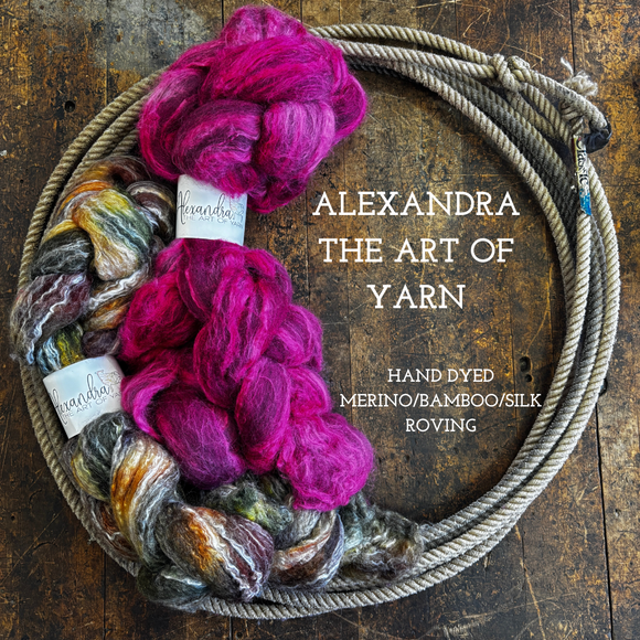 Braids of hand dyed wool bamboo silk roving on a wooden surface