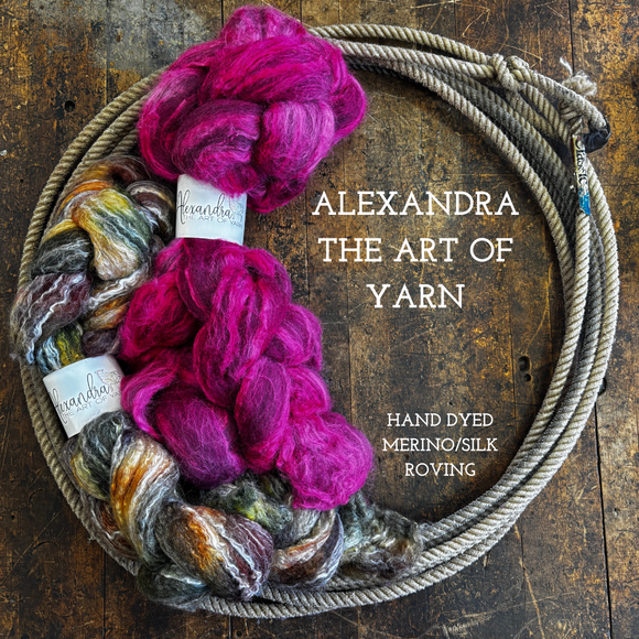 Braids of hand dyed wool silk roving on a wooden surface