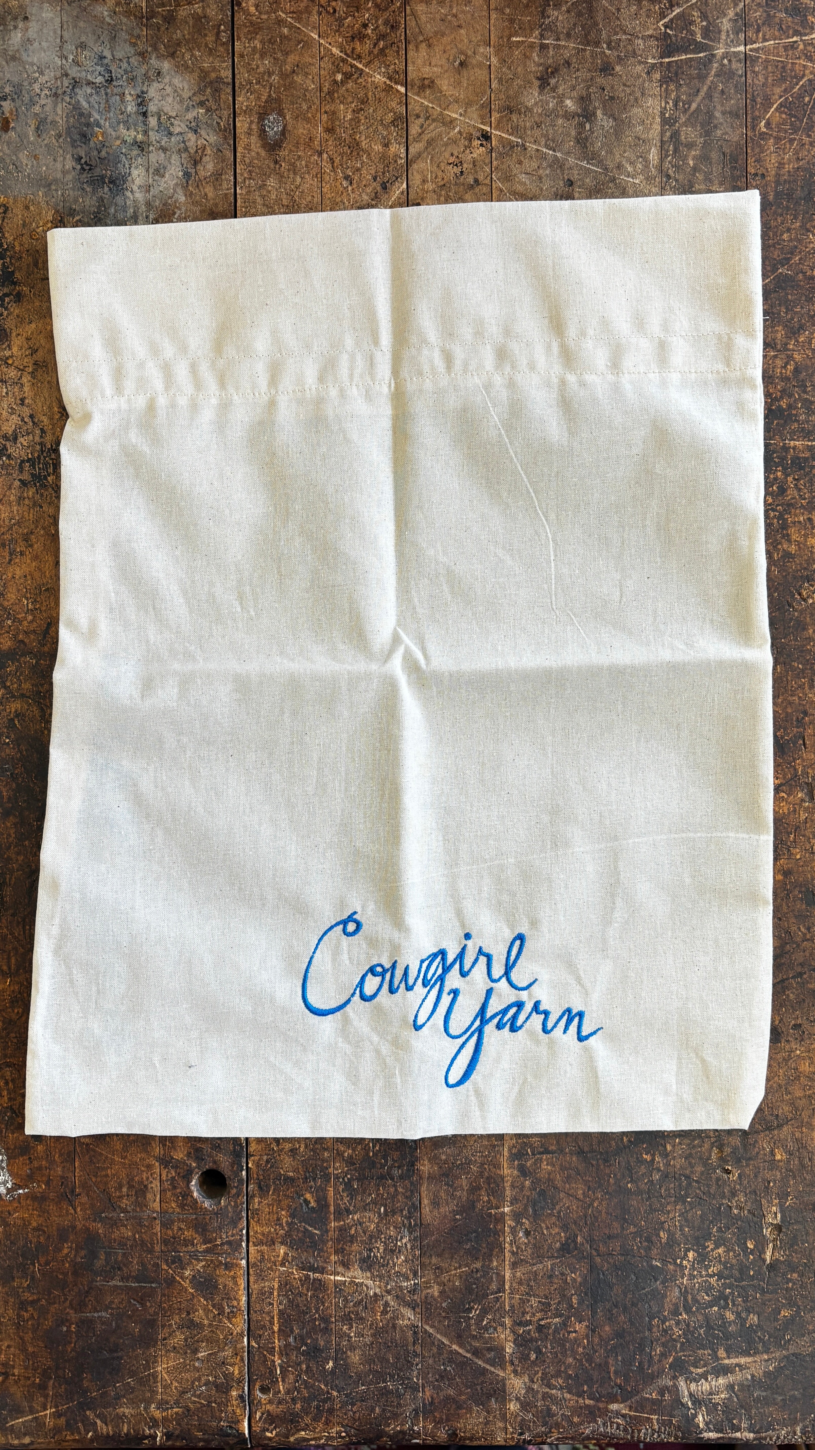 Cloth project bag with Cowgirl Yarn hand embroidered