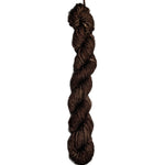 Brown skein of wool yarn on a white background
