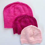 3 Base Doodle Beanies in various sizes knit in the colors pink magenta and light pink