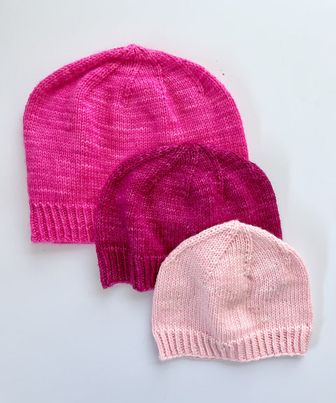3 Base Doodle Beanies in various sizes knit in the colors pink magenta and light pink