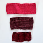 Base Doodle Headbands knit in various sizes in the colors red purple and red yarn