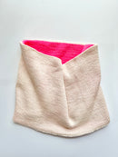 A Base Doodle Reversible Cowl knit in the colors off-white and pink