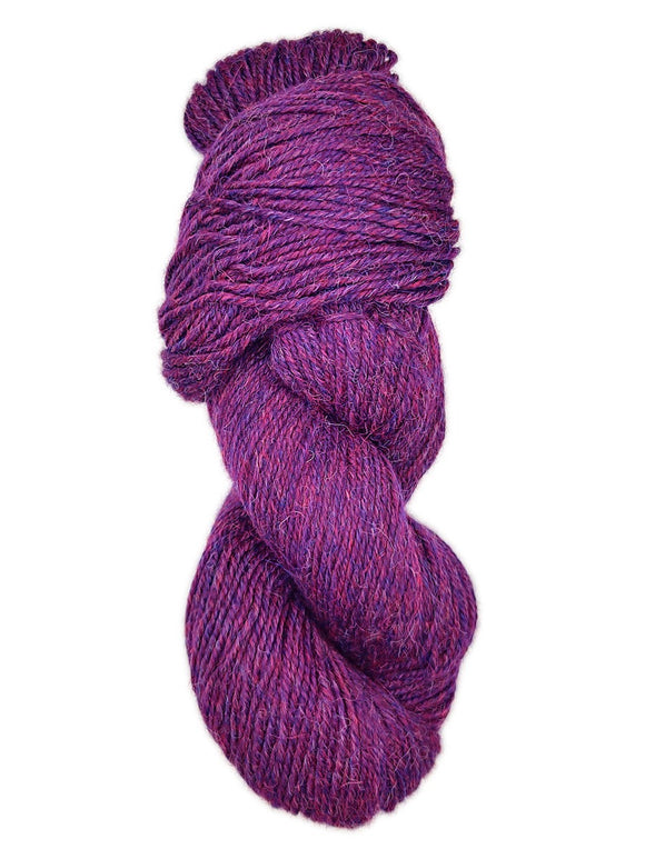 Skein of alpaca yarn color purple and pink flecked mix