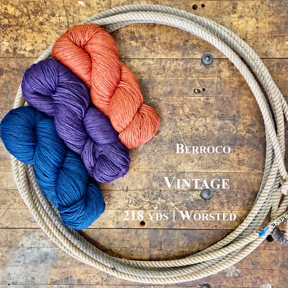 Skeins of Berroco Vintage Wool Yarn on a wooden surface