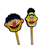 Two stitch stoppers of bert and ernie on wooden needles