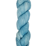 A skein of hand-dyed fingering/sock yarn color sky blue