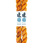 Blackbird Sycamore Fingering Mini Skein color orange with dark brown flecks