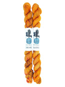 Blackbird Sycamore Fingering Mini Skein color orange with dark brown flecks