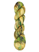 A skein of hand-dyed fingering/sock yarn color tan and green speckles