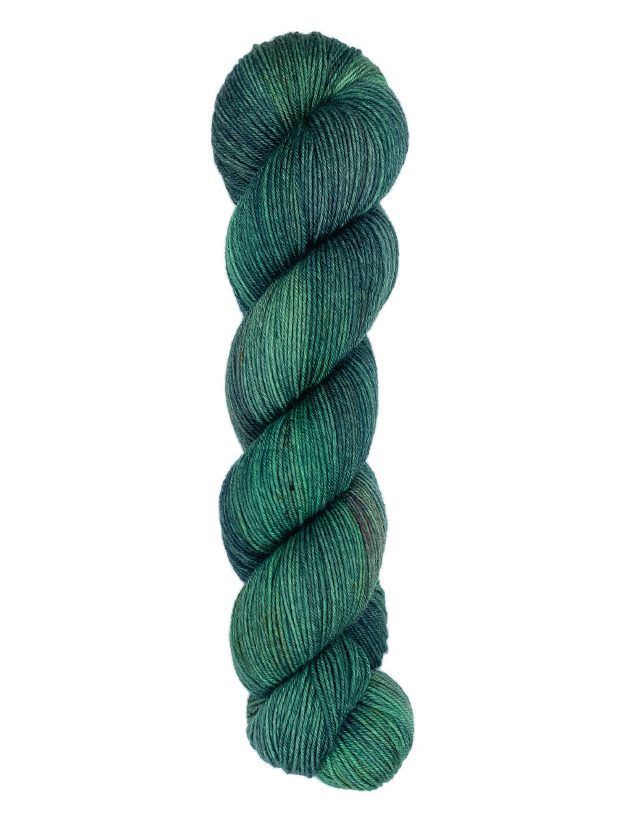 A skein of hand-dyed fingering/sock yarn color dark green