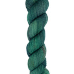 A skein of hand-dyed fingering/sock yarn color dark green