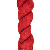 A skein of hand-dyed fingering/sock yarn color red