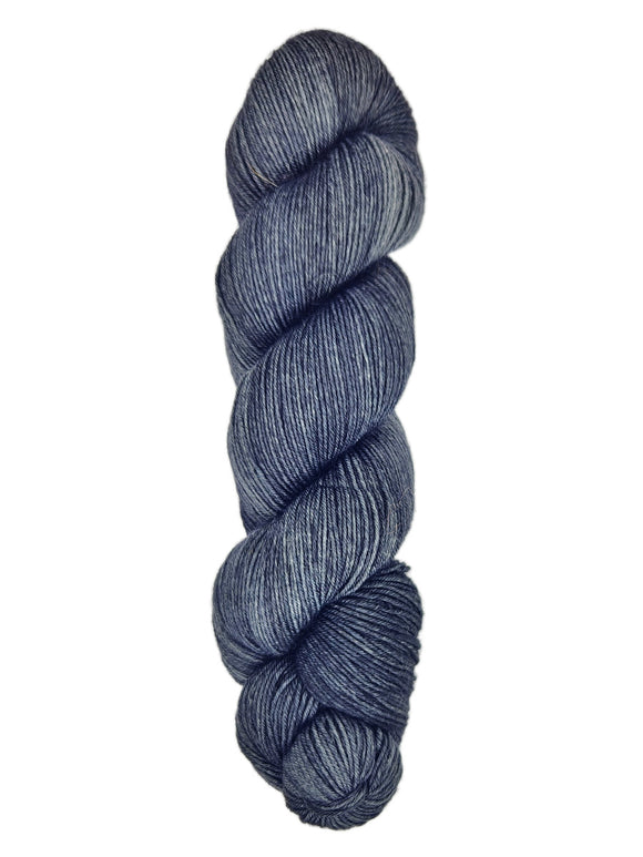 A skein of hand-dyed fingering/sock yarn color black