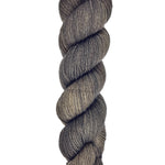 A skein of hand-dyed fingering/sock yarn color dark gray brown