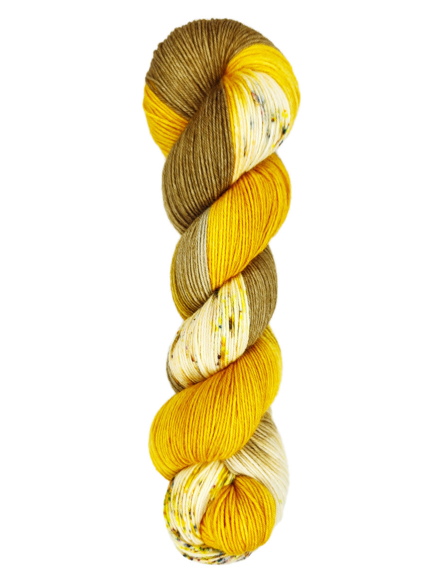 A skein of hand-dyed fingering/sock yarn color brown and gold speckles