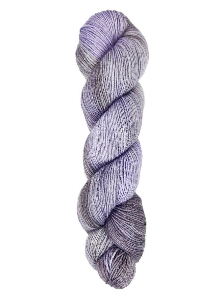 A skein of hand-dyed fingering/sock yarn color gray sky blue