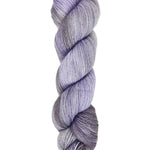 A skein of hand-dyed fingering/sock yarn color gray sky blue