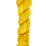 A skein of hand-dyed fingering/sock yarn color yellow