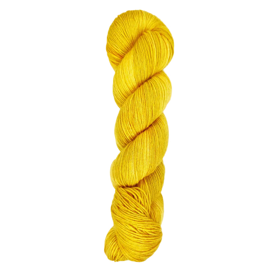 Yellow gold skein of yarn on a sock base