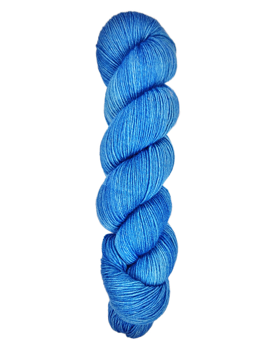 A skein of hand-dyed fingering/sock yarn color blue
