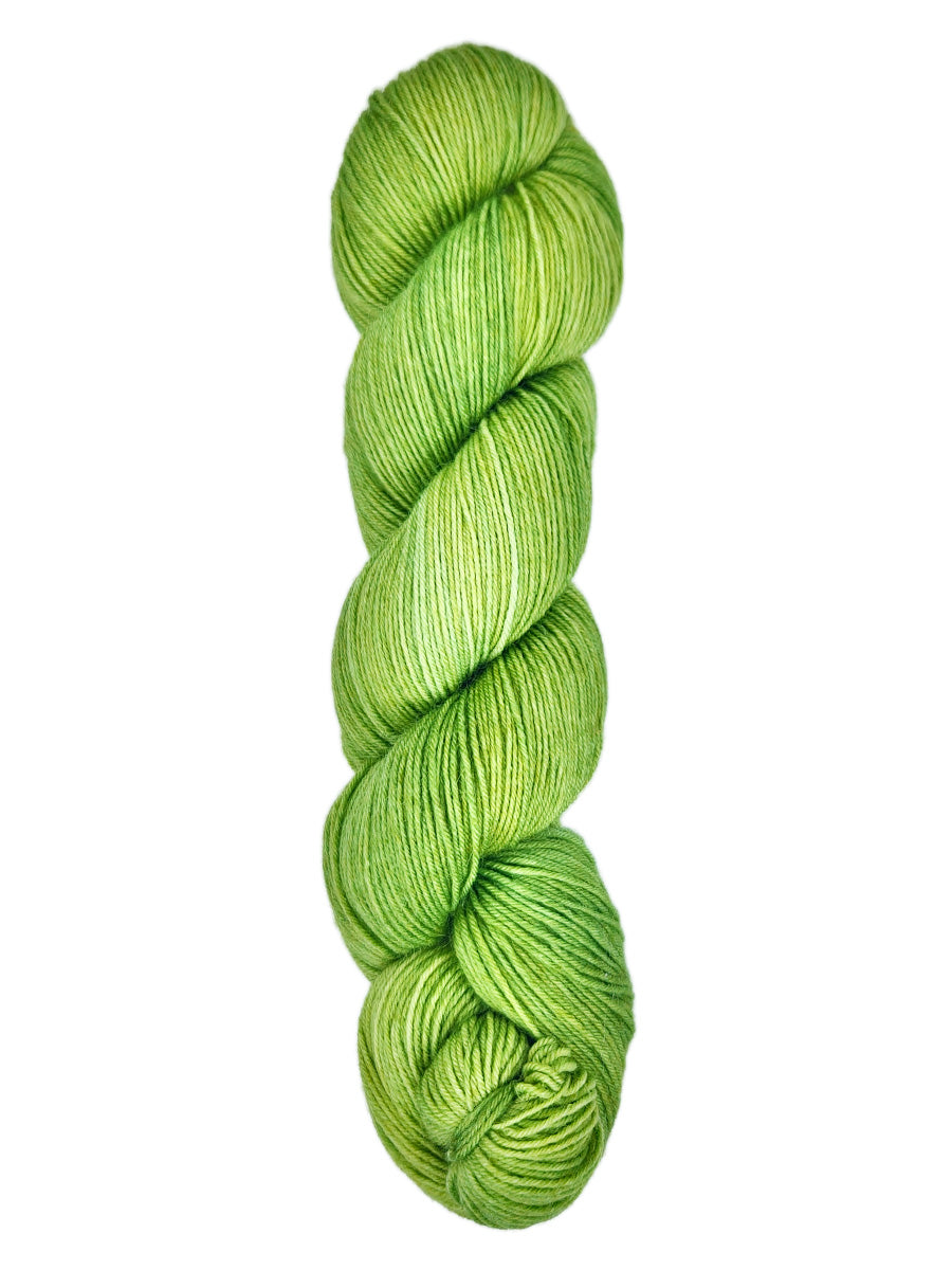 A skein of hand-dyed fingering/sock yarn color bright green