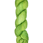 A skein of hand-dyed fingering/sock yarn color bright green