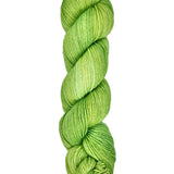 A skein of hand-dyed fingering/sock yarn color bright green