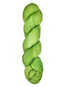 A skein of hand-dyed fingering/sock yarn color bright green