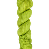 A skein of hand-dyed fingering/sock yarn color bright green