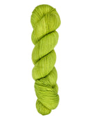 A skein of hand-dyed fingering/sock yarn color bright green