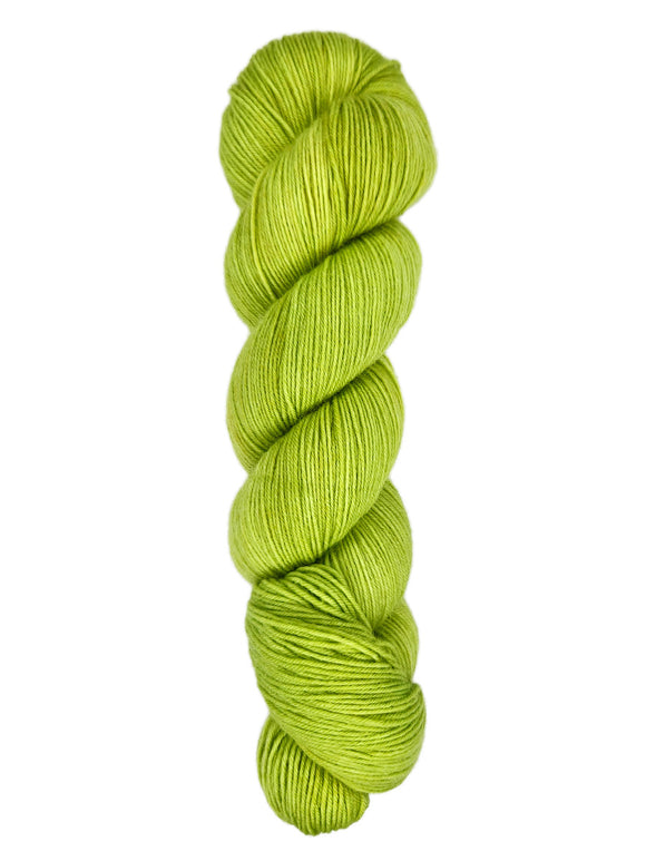 A skein of hand-dyed fingering/sock yarn color bright green