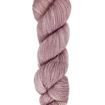 A skein of hand-dyed fingering/sock yarn color dusty pink