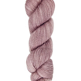A skein of hand-dyed fingering/sock yarn color dusty pink