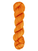 A skein of hand-dyed fingering/sock yarn color orange