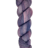 A skein of hand-dyed fingering/sock yarn color purple blue pink