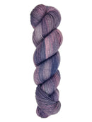 A skein of hand-dyed fingering/sock yarn color purple blue pink