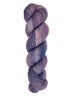 A skein of hand-dyed fingering/sock yarn color purple blue pink