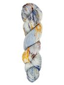 A skein of hand-dyed fingering/sock yarn color gray and orange blue speckles