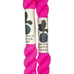 Two mini skeins of wool yarn hand dyed in Wyoming in the color pink