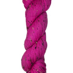 Skein of hand dyed BFL Tweed yarn in a neon pink color